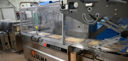 Tighter wrap around pizza leads to better packing efficiencies and improved costs